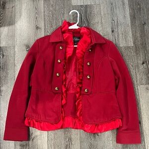 Red women’s short overcoat with ruffles